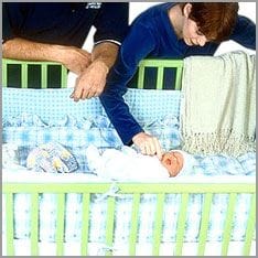 Baby sleeps in bed