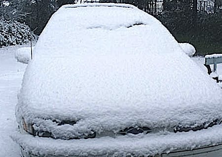 snow-covered car