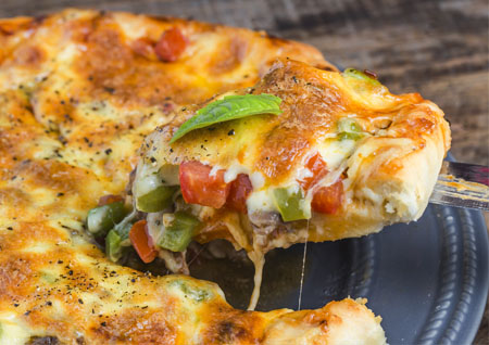 greasy pizza in the box