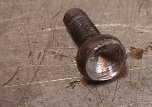 Screw with worn screw head