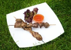 Grilled red meat on a skewer