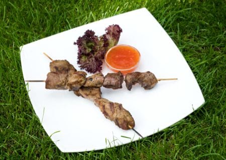 Grilled red meat on a skewer
