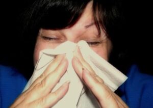Sneezing woman