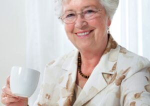 elderly lady drinking coffee