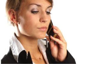 Young woman at work on the phone