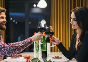 Elegant couple toasting with wine