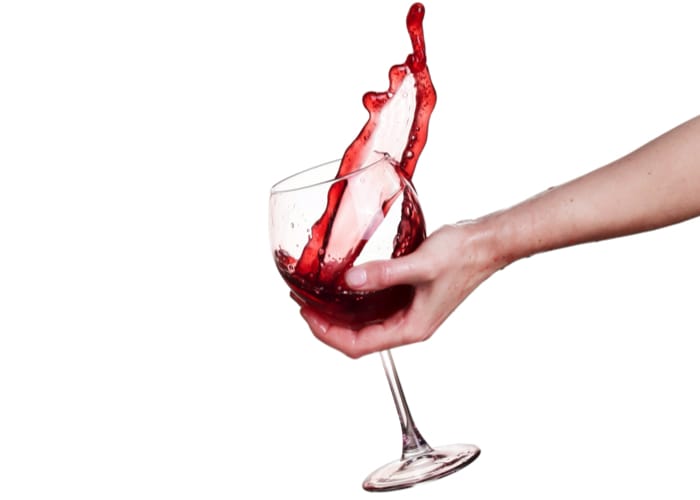 How do you hold a wine glass correctly?